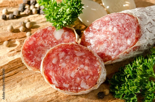 Fototapeta Closeup of a sliced dried salami