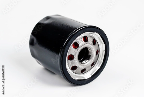 Fototapeta New oil filter car isolated on white background.cleaning internal combustion engine.
