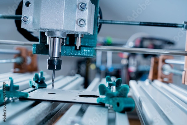 Fototapeta CNC milling machine cutting aluminium  part.