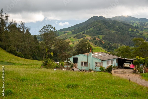Fototapeta Colombian countryside with a small garage with a classic car in the Department of Boyaca.