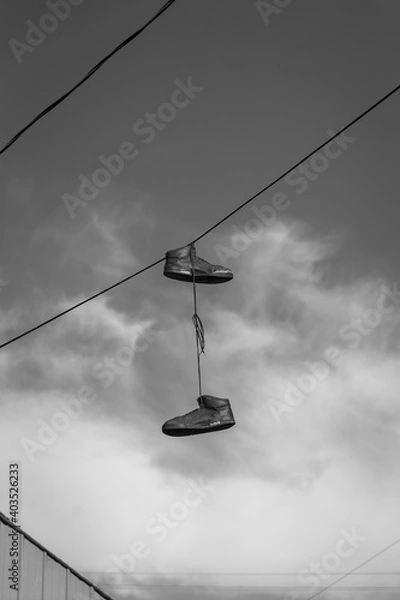 Fototapeta Shoes Hanging from Wire