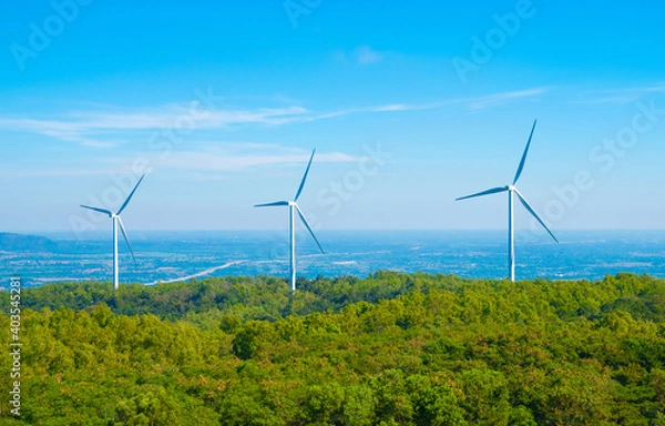 Fototapeta A large wind turbine was installed in the middle of the forest to generate electricity.