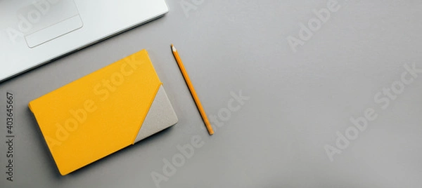 Fototapeta Yellow diary on a gray background