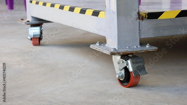 Obraz Red Caster Wheel or Trolley Wheels. Heavy-duty polyurethane plastic roller on cement deck with copy space. Select the content and close the focus.