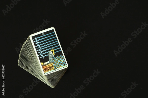 Fototapeta 9 swords Tarot cards With a black space on the left to write a message.