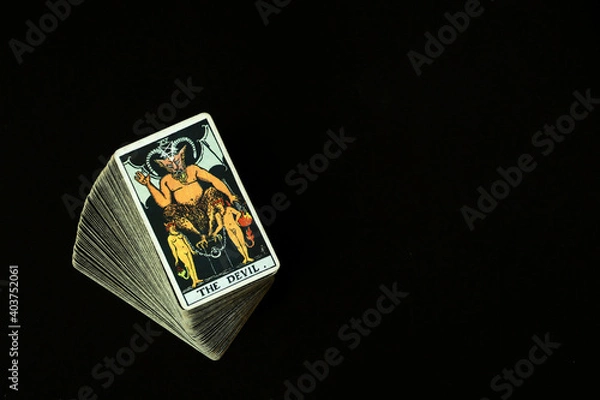 Fototapeta The Devil Tarot cards With a black space on the left to write a message.