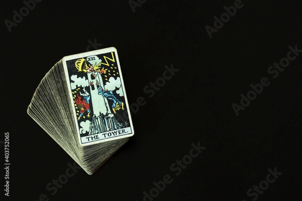 Fototapeta The Tower Tarot cards With a black space on the left to write a message.
