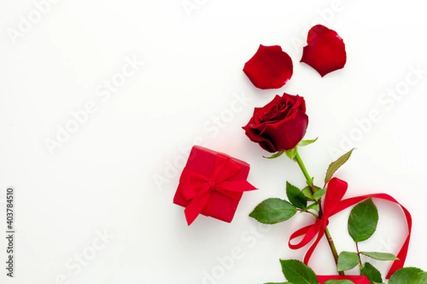 Obraz Valentine's Day. Red rose with a ribbon, love letter and red box.