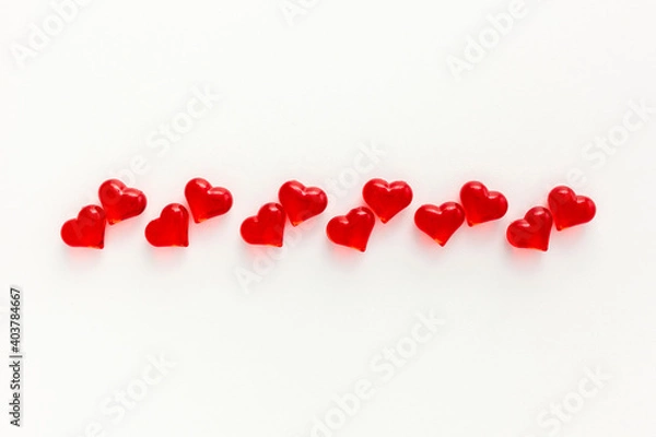 Fototapeta Concept of small multi-colored glass hearts