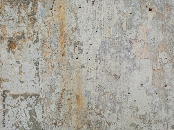 Fototapeta The old concrete wall is painted with paints.