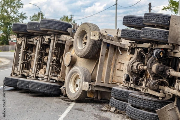 Fototapeta view of an overturned truck on an highway in an accident.