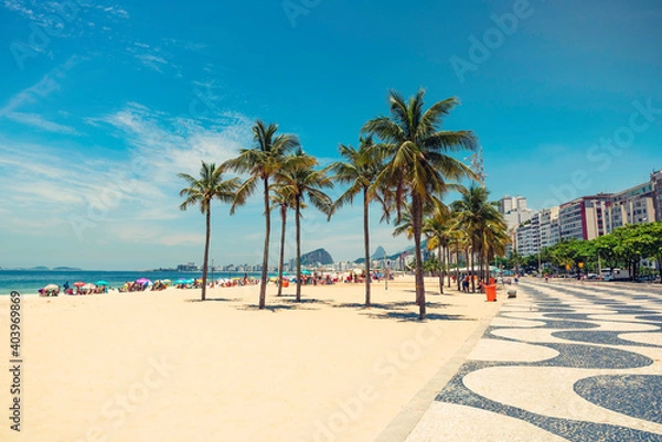 Fototapeta Palms on Copacabana Beach next to landmark mosaic in Rio de Janeiro, Brazil