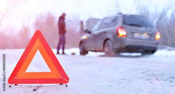 Obraz car repair on the road in winter. Car triangle on winter road. Problem with vehicle on snowy road. Broken cars concept. banner of snowy winter road