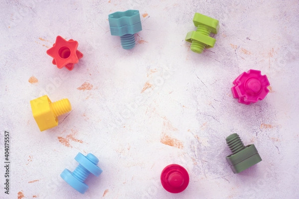 Fototapeta educational constructor for children, nuts and bolts in the form of geometric shapes. mock up background