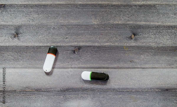 Fototapeta USB stick on the table. Photo of a flash drive on a wooden table