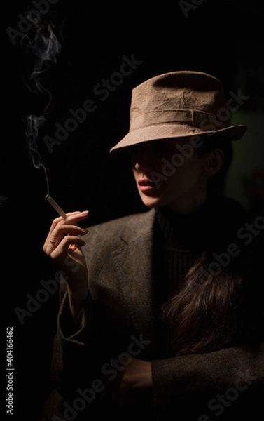 Obraz girl with a cigarette and in the dark