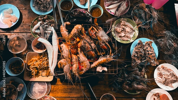 Fototapeta Shrimp and crab grilled in a plate on the table at the seafood buffet restaurant.