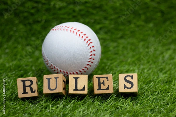 Obraz Baseball rules is on green grass background
