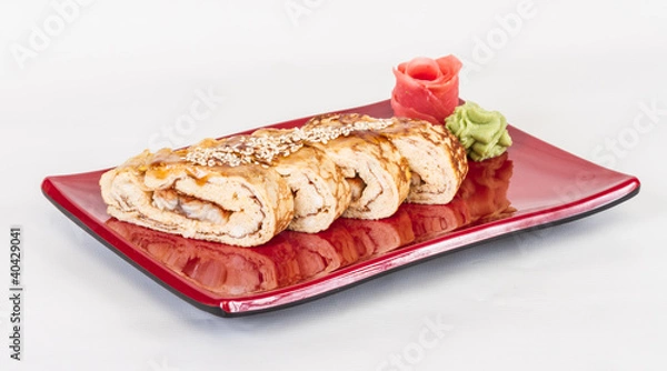 Fototapeta Omelet Maki Sushi - Roll made of Smoked Eel inside. Topped with