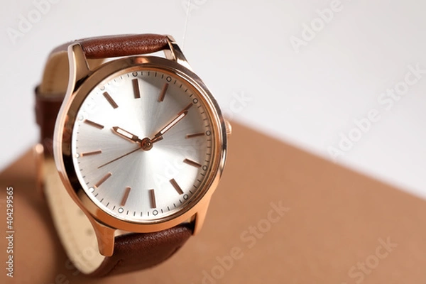 Fototapeta Luxury wrist watch on color background, closeup. Space for text