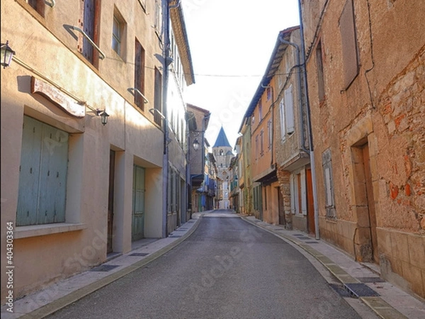 Fototapeta A narrow street in an empty provincial town