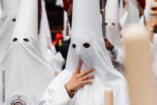 Obraz penitents in a white-dressed Easter procession in Almeria, southern Spain.