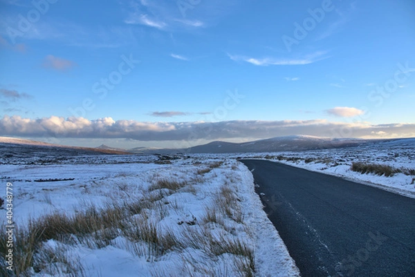 Obraz Stunning winter view of Old Military Road (R115) traversing along the ridge of Wicklow Mountains, Co. Wicklow, Ireland. Leading lines. Irish winter