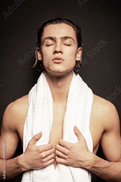 Obraz Strong stripped muscle male model in white underwear on black isolated font background