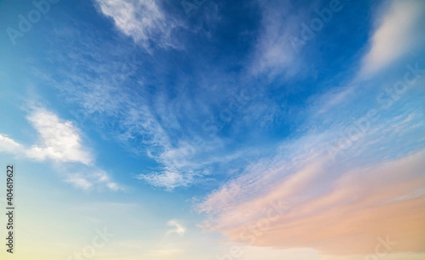 Fototapeta Beautiful colorful bright sunset sky with orange clouds. Nature sky background.