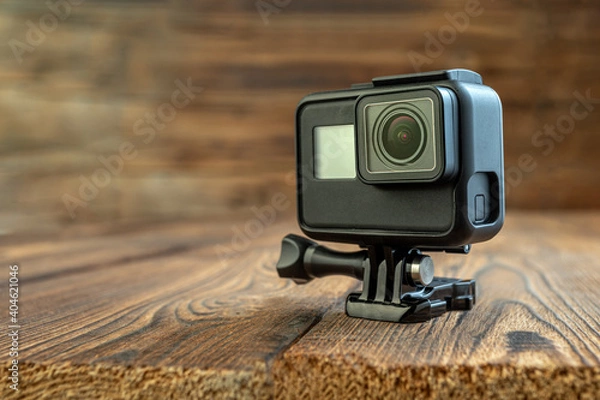 Obraz action camera on wooden background