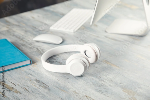 Fototapeta earphone with notebook on working table