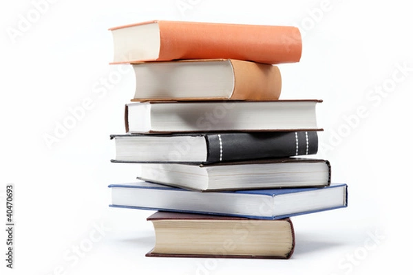 Fototapeta A stack of books on a white background.