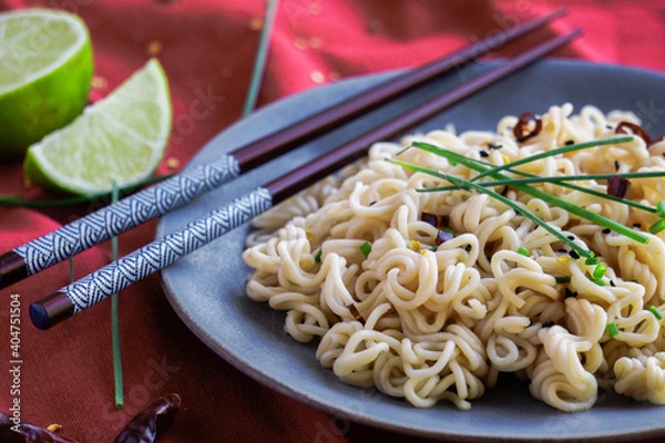 Fototapeta Thai noodles with spicy chili and lime. Selective focus. Close up views._