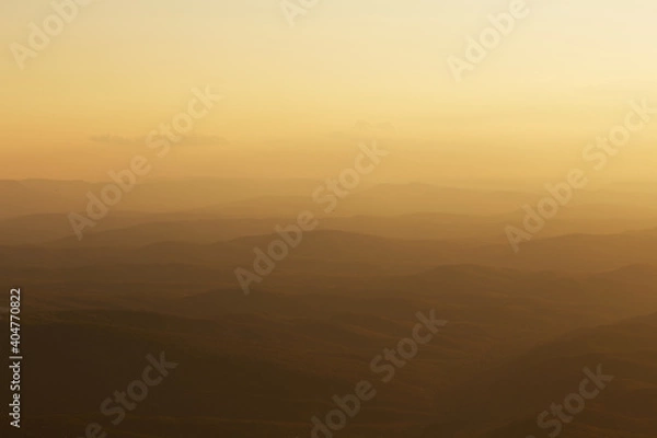 Fototapeta background of mountains in yellow light