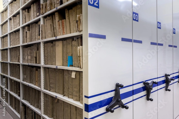 Obraz archive, file, registration , mobile shelves with documents. Archive or office