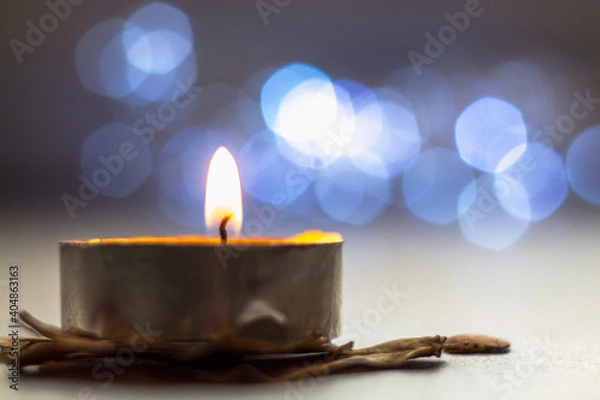 Obraz burning candle on a dark background