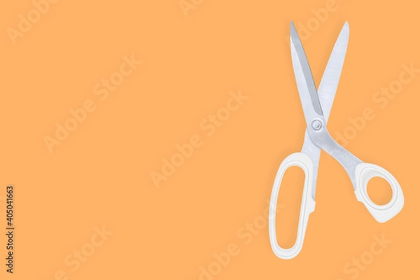 Fototapeta Scissors seamless pattern. Barber scissors against orange background backdrop.