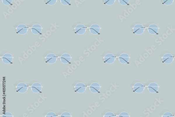 Fototapeta Glasses seamless pattern. Glasses for improving vision on a gray background.