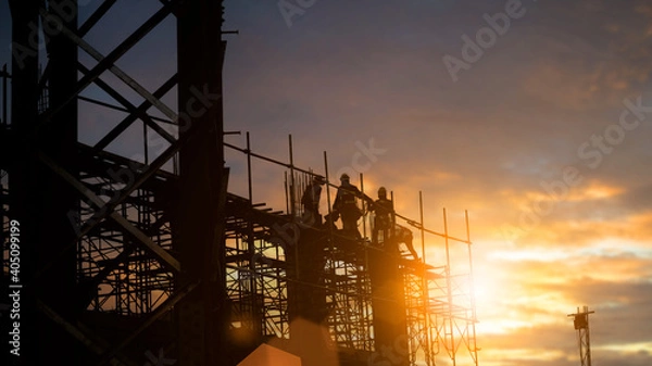 Obraz Silhouette Engineer and construction team working at site over blurred  industry background with Light fair Film Grain effect.