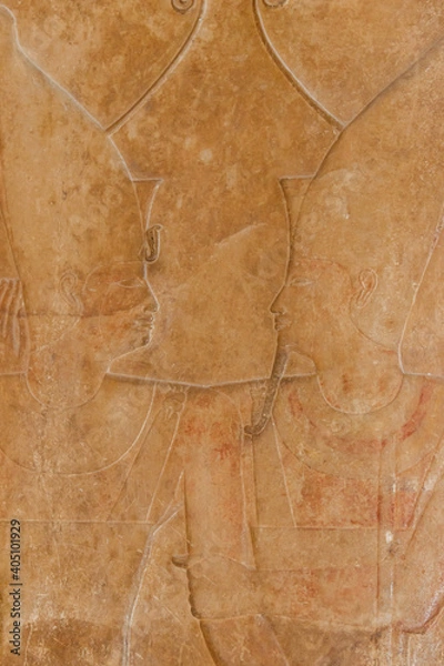 Fototapeta Ancient egyptian paintings and hieroglyphs carved on the stone wall