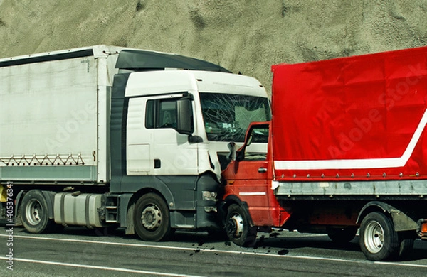Fototapeta Road accident between two trucks. Frontal collision.