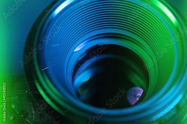 Fototapeta Camera lens with lens reflections on bright background.