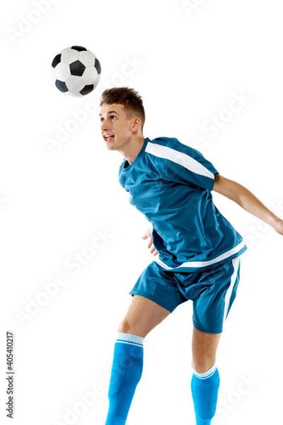 Fototapeta Kick. Funny emotions of professional soccer player isolated on white studio background. Copyspace for ad. Excitement in game, human emotions, facial expression and passion with sport concept.