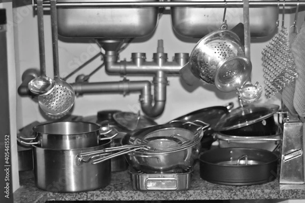 Fototapeta kitchen utensils stored below the sink