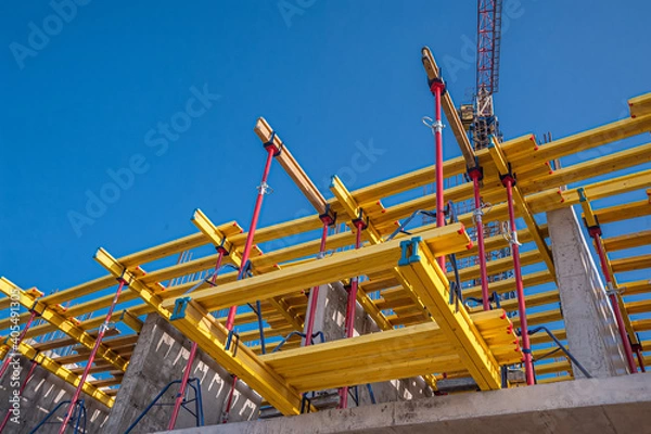Obraz Horizontal formwork and crane at the construction of a residential building.
