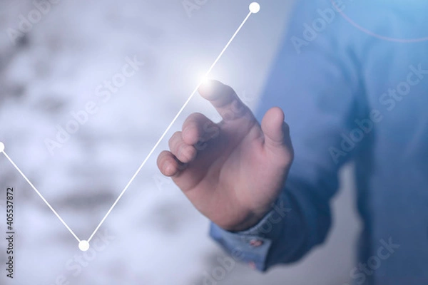 Fototapeta Dłoń dotykająca rosnący wykres. Koncepcja zysku, odbudowy rynku i kapitałów