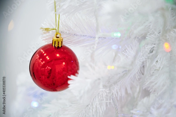 Obraz Red Christmas ball toy on a white Christmas tree