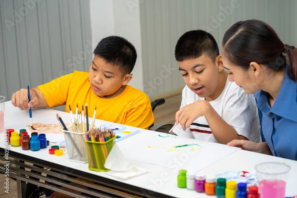 Obraz Asian disability child boy and Autism kid learning drawing in classroom