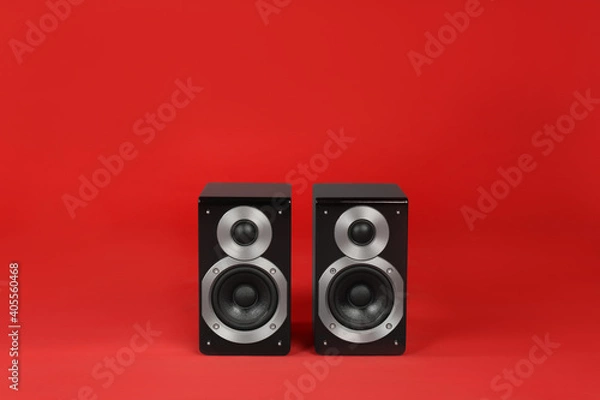 Obraz Modern powerful audio speakers on red background