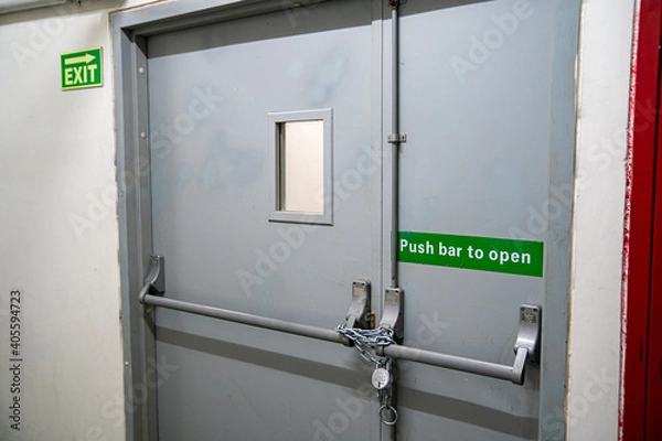 Fototapeta There's no escape (emergency exit locked with steel chain)